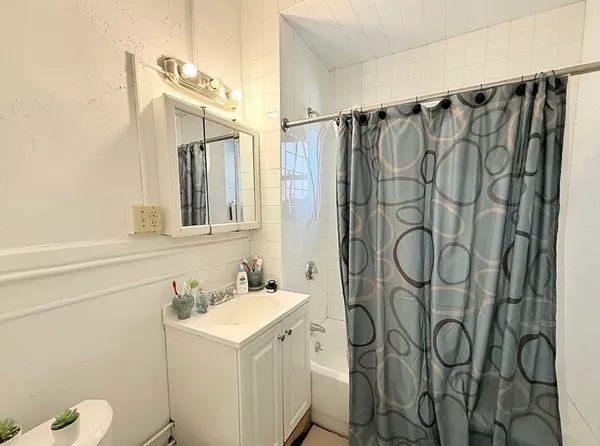 a bathroom with a sink and mirror