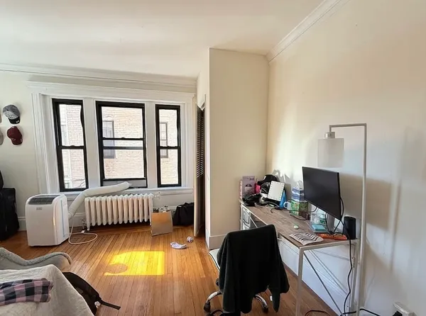 a living room with furniture fireplace and a flat screen tv