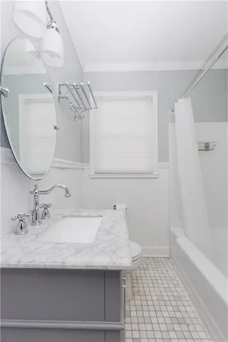 a bathroom with a sink a vanity and a mirror