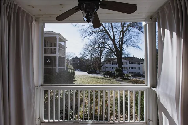 a view of a balcony with wooden floor