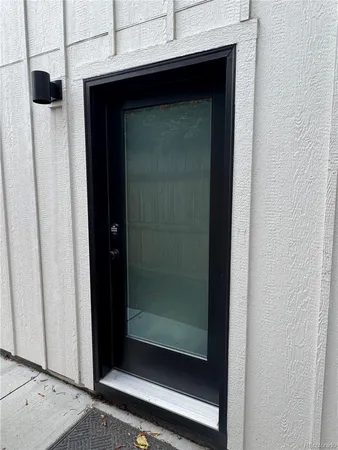 a bathroom with a glass shower door