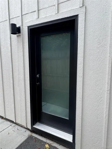 a bathroom with a glass shower door