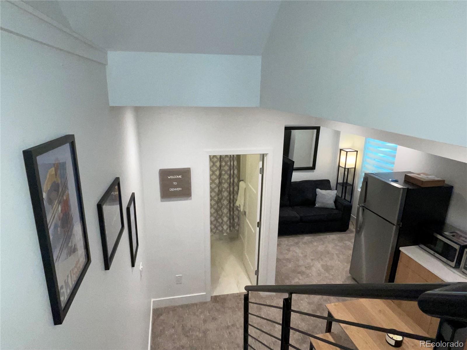 1310 Zenobia Street Denver, CO 80204 - Photo 4 of 9 a living room with furniture and a window