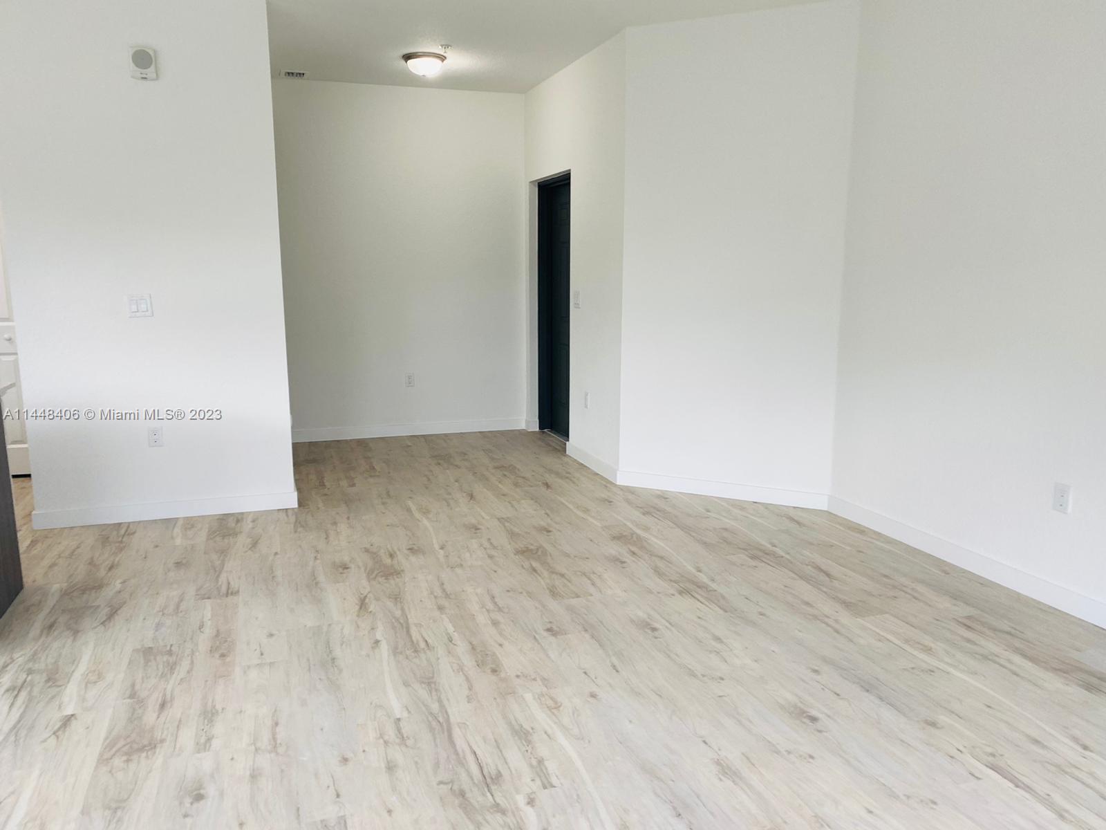 15520 Southwest 136th Street, Unit 106 Miami, FL 33196 - Photo 2 of 11 a view of an empty room
