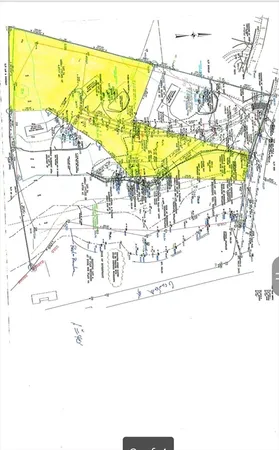 a view of a swimming pool with a lawn chairs