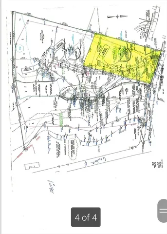 a picture of a room with a bench and a white bed