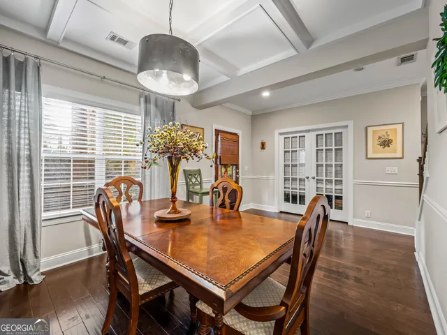 a dining room with furniture and window
