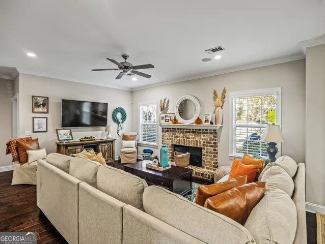 a living room with furniture and a fireplace