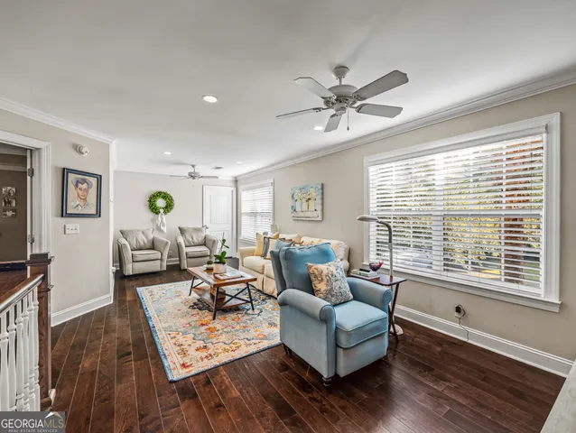 a living room with furniture and a rug
