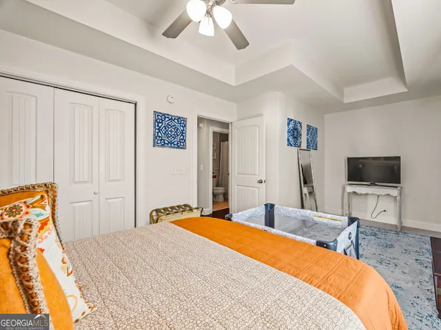 a bed room with a bed and a chair