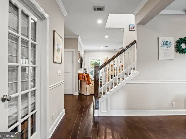 a view of entryway with stairs and wooden floor