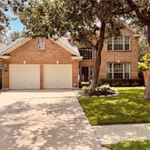 a front view of a house with yard
