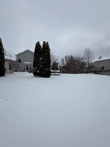 a bed sitting in a room next to a building