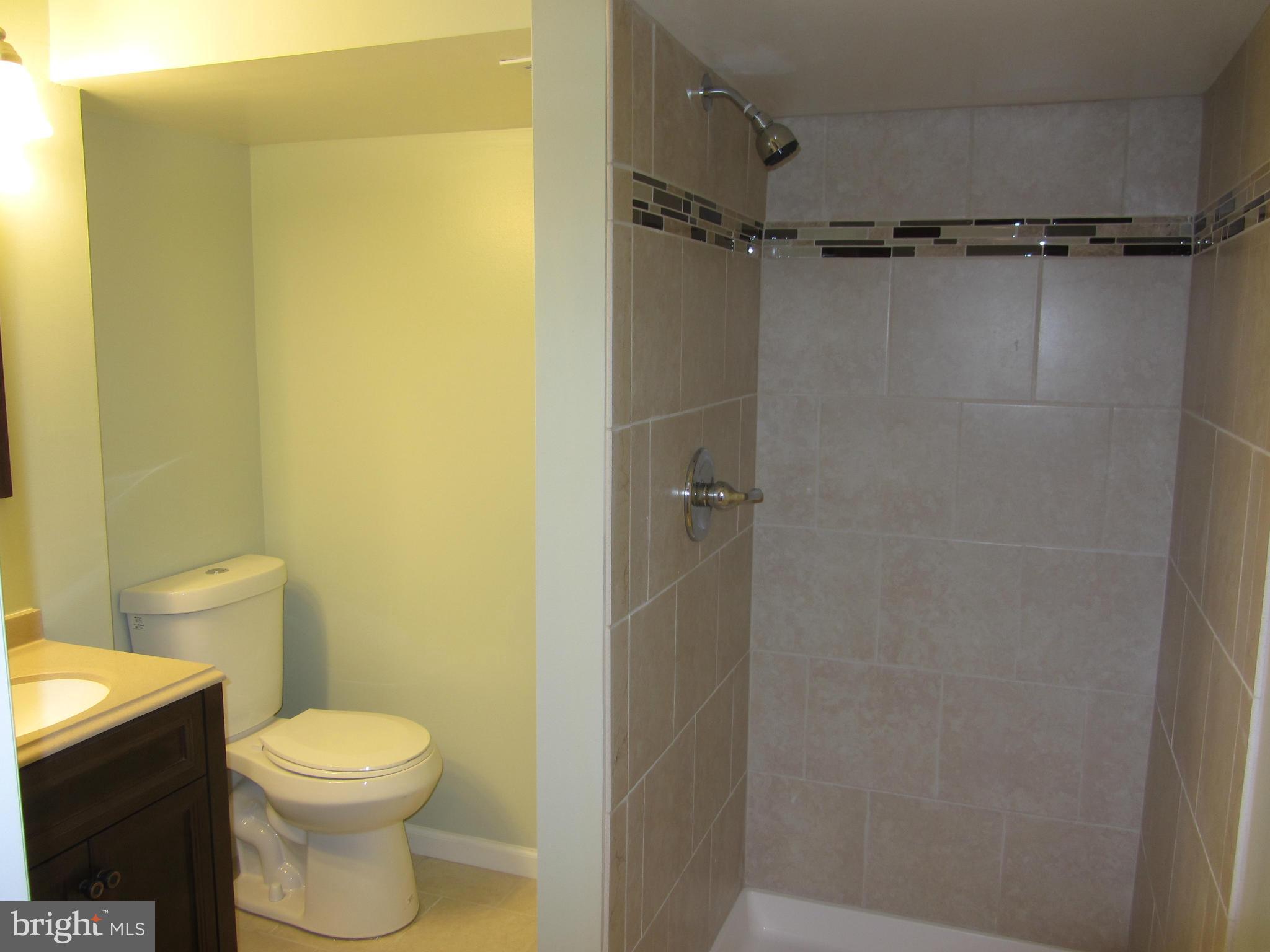 1645 Northgate Road Baltimore, MD 21218 - Photo 2 of 23 a bathroom with a toilet and a shower