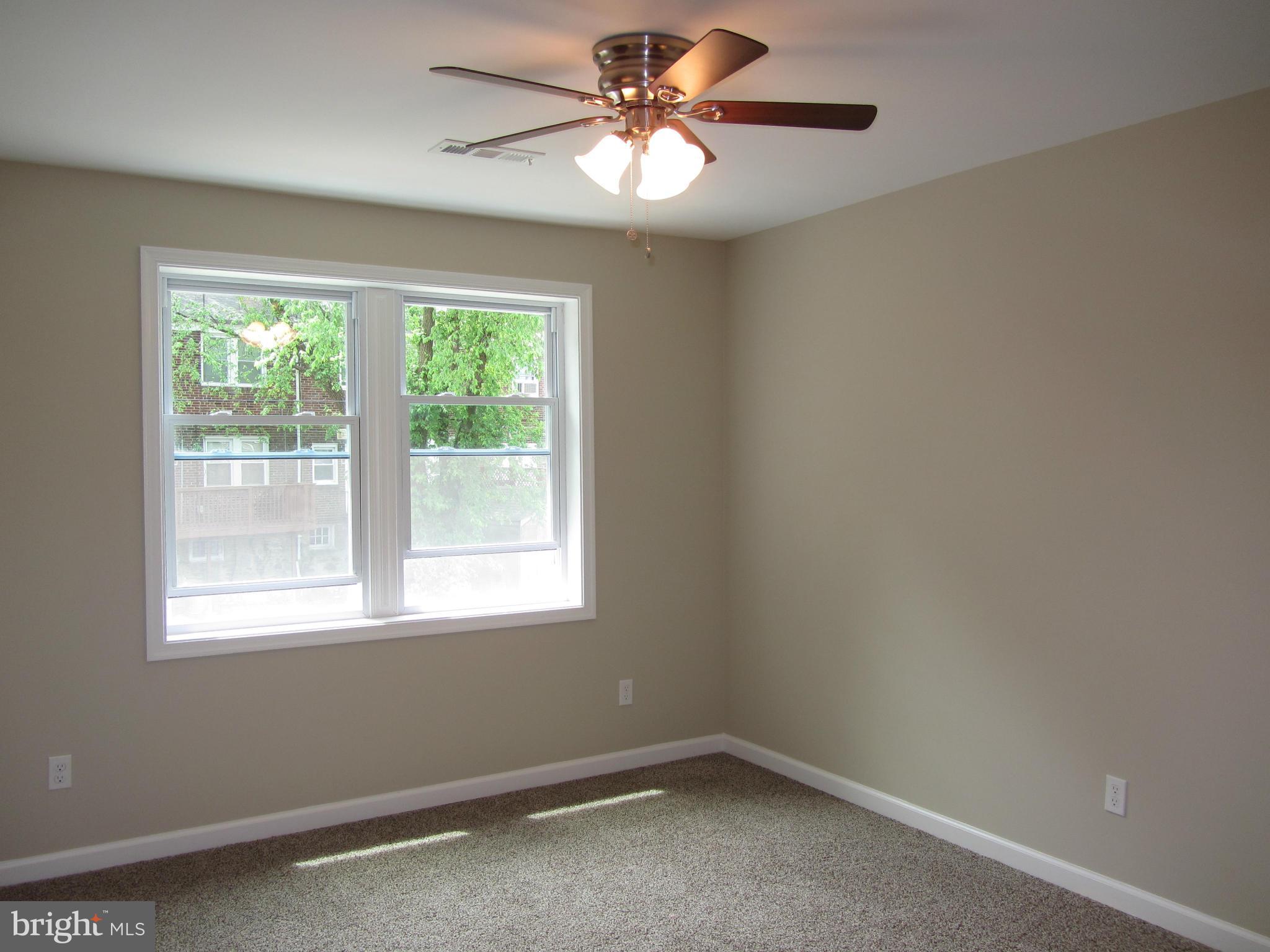 1645 Northgate Road Baltimore, MD 21218 - Photo 11 of 23 a room with a window and a fan