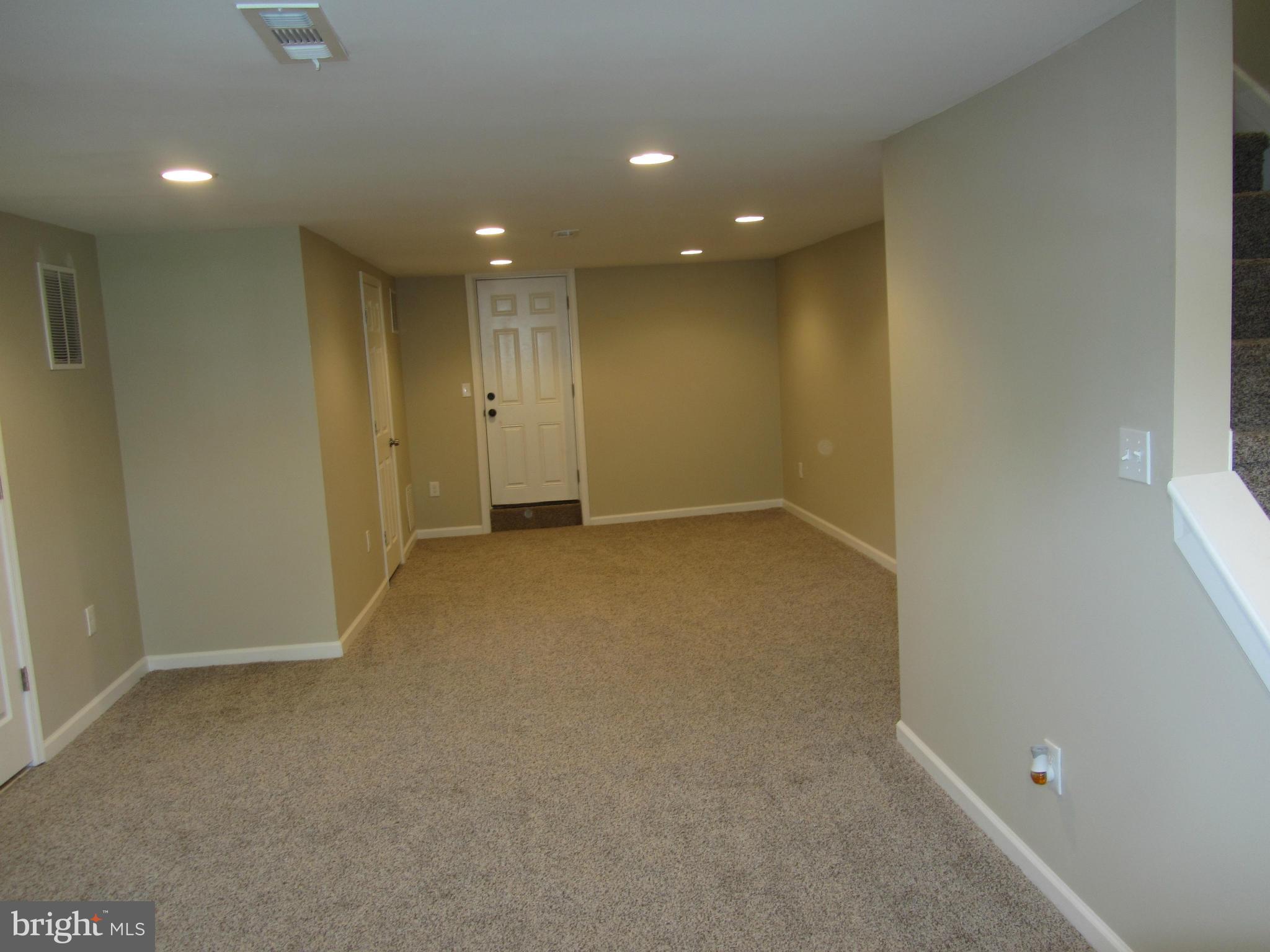 1645 Northgate Road Baltimore, MD 21218 - Photo 4 of 23 an empty room with a natural light