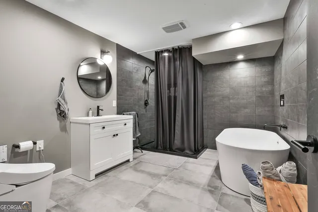 a spacious bedroom with a bed and a table