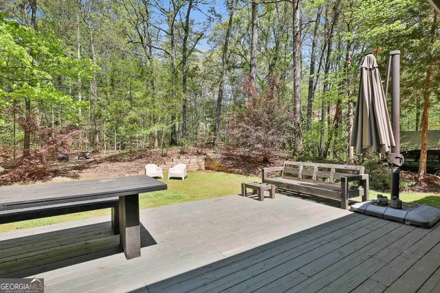 a view of yard with large trees