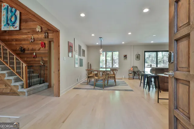 an outdoor space with lots of chairs and mirrors