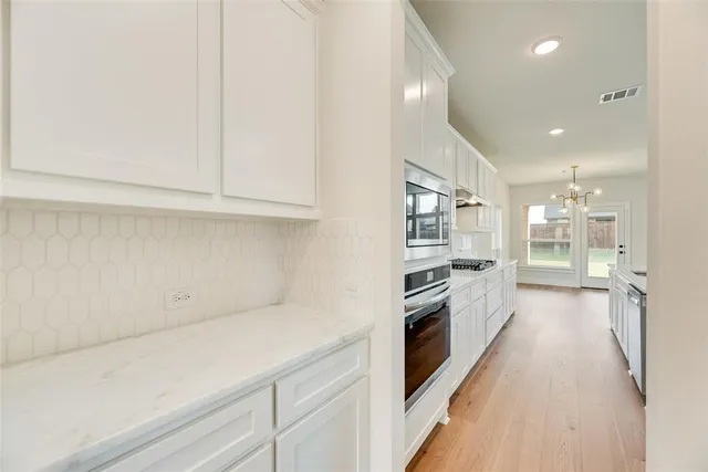 a view of a kitchen with electric equipment