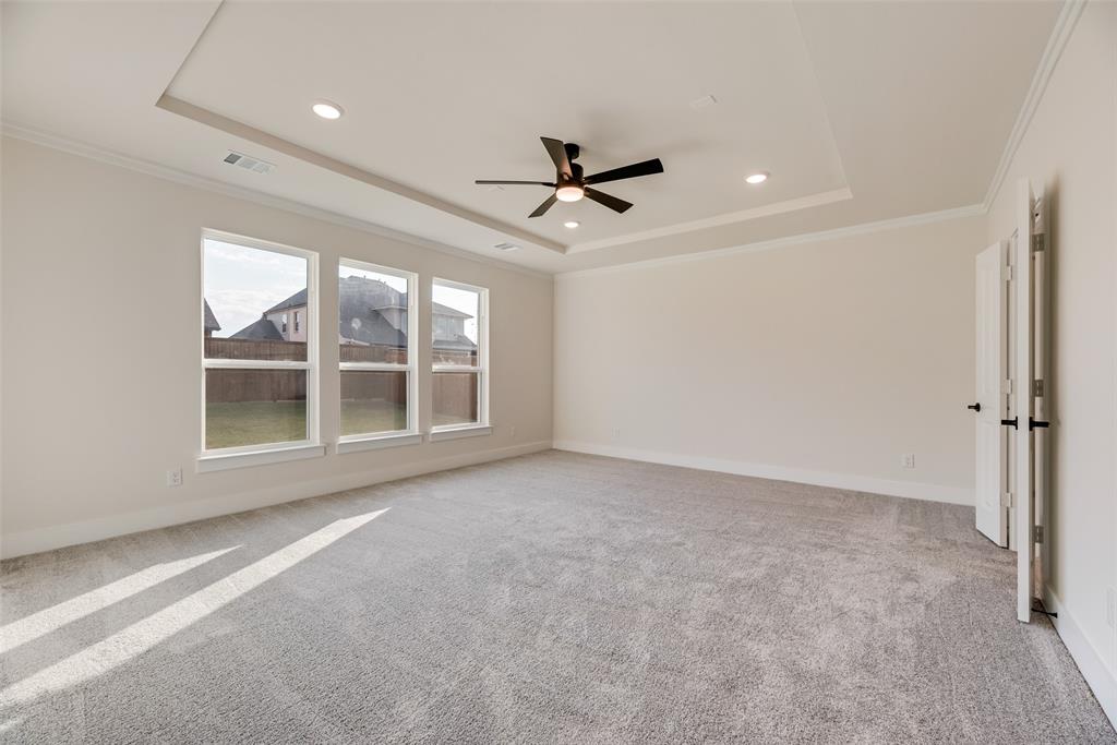1055 Modesto Drive Frisco, TX 75036 - Photo 12 of 29 an empty room with windows and ceiling fan