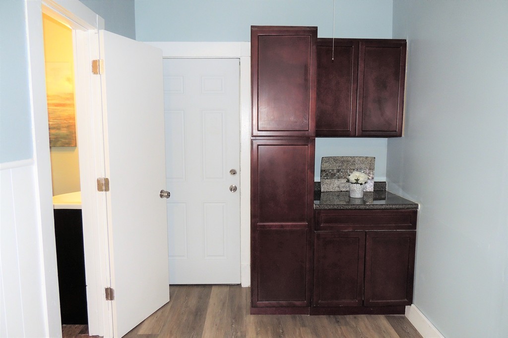 73 Crystal Avenue Springfield, MA 01108 - Photo 12 of 30 a kitchen with a refrigerator and cabinets