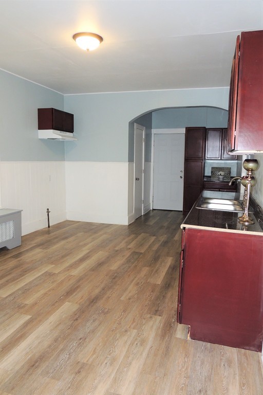73 Crystal Avenue Springfield, MA 01108 - Photo 14 of 30 a kitchen with stainless steel appliances kitchen island granite countertop a stove a sink and a refrigerator