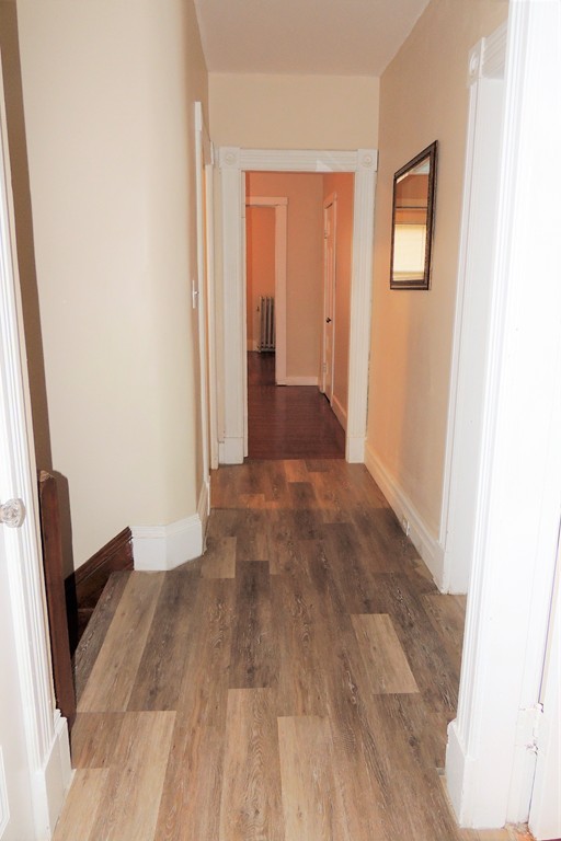 73 Crystal Avenue Springfield, MA 01108 - Photo 16 of 30 a view of a hallway with wooden floor