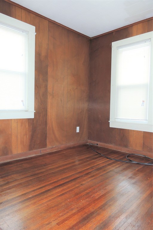 73 Crystal Avenue Springfield, MA 01108 - Photo 17 of 30 an empty room with wooden floor and windows