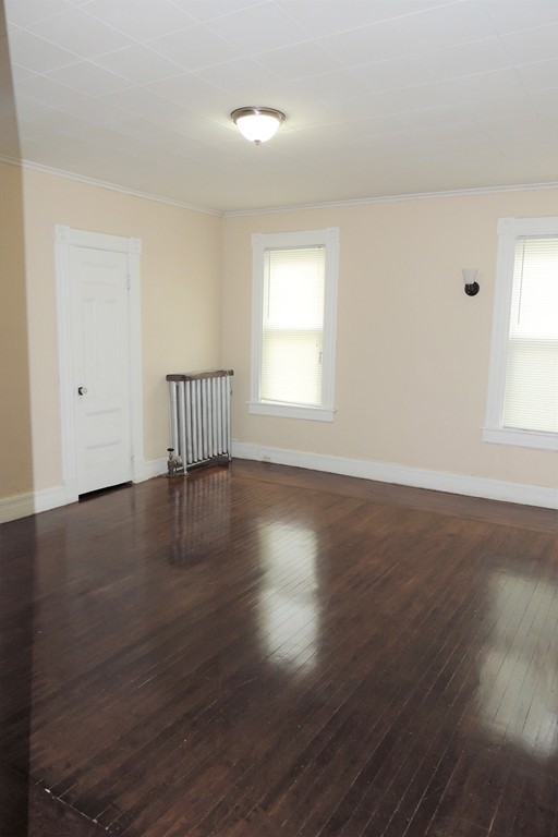 73 Crystal Avenue Springfield, MA 01108 - Photo 21 of 30 an empty room with wooden floor and windows