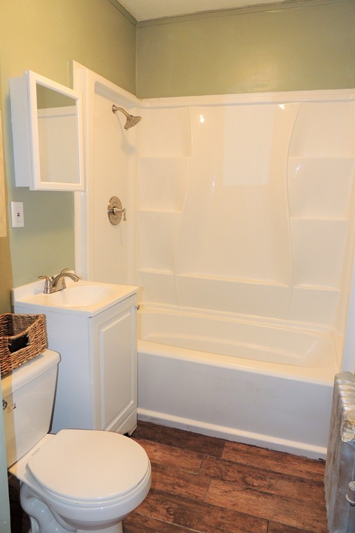 73 Crystal Avenue Springfield, MA 01108 - Photo 22 of 30 a bathroom with a toilet a sink and bathtub