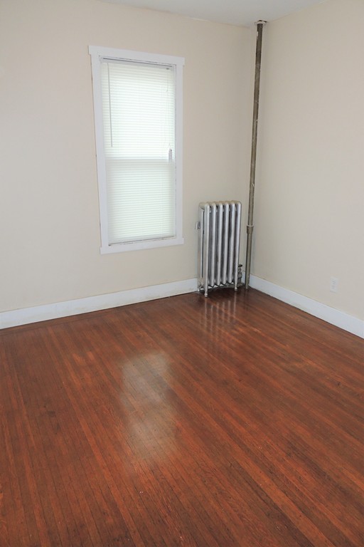 73 Crystal Avenue Springfield, MA 01108 - Photo 24 of 30 an empty room with wooden floor and windows