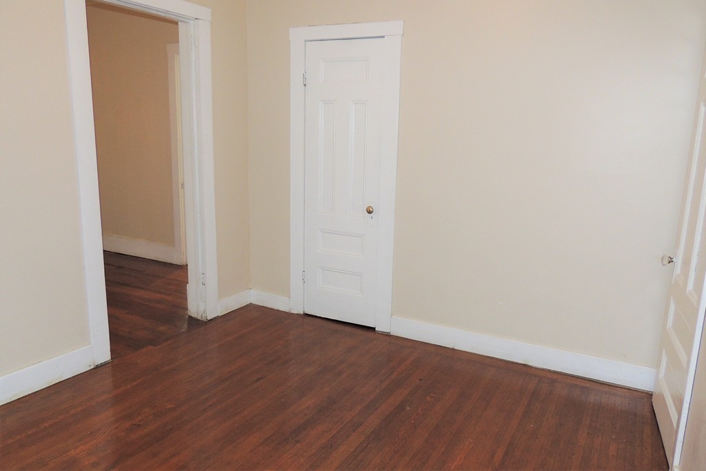 73 Crystal Avenue Springfield, MA 01108 - Photo 25 of 30 a view of an empty room with wooden floor
