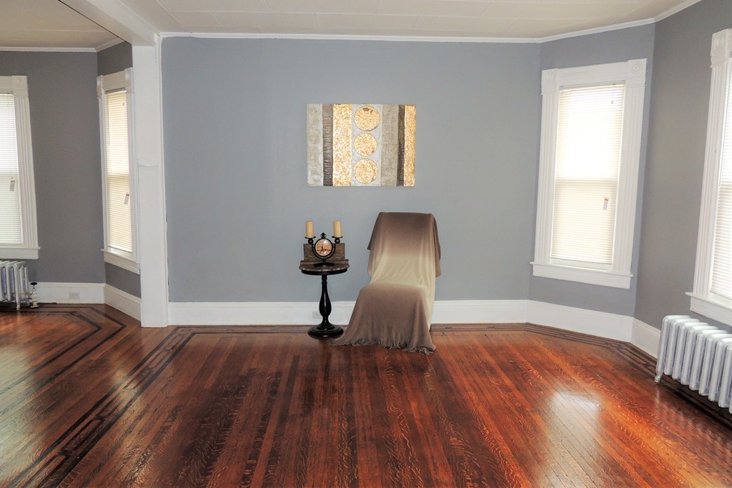 73 Crystal Avenue Springfield, MA 01108 - Photo 3 of 30 a view of empty room with a window and wooden floor