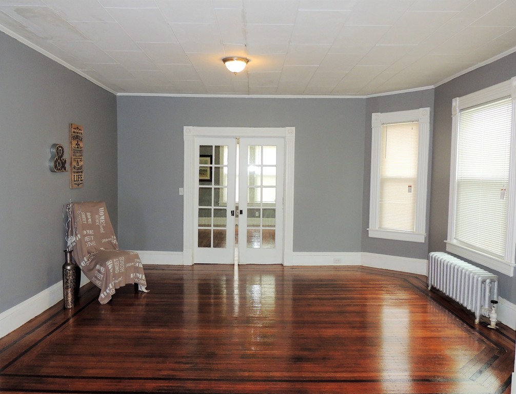73 Crystal Avenue Springfield, MA 01108 - Photo 6 of 30 a view of livingroom with furniture wooden floor and windows