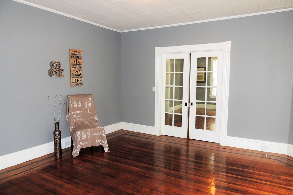 73 Crystal Avenue Springfield, MA 01108 - Photo 7 of 30 a view of a livingroom with wooden floor and a window