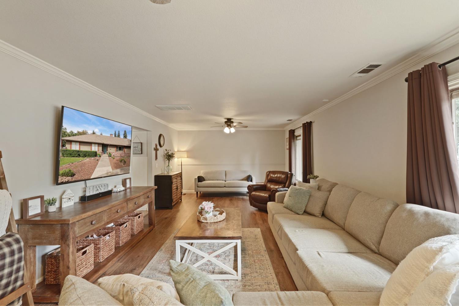 12963 Spring Time Lane Galt, CA 95632 - Photo 14 of 49 a living room with furniture and a flat screen tv