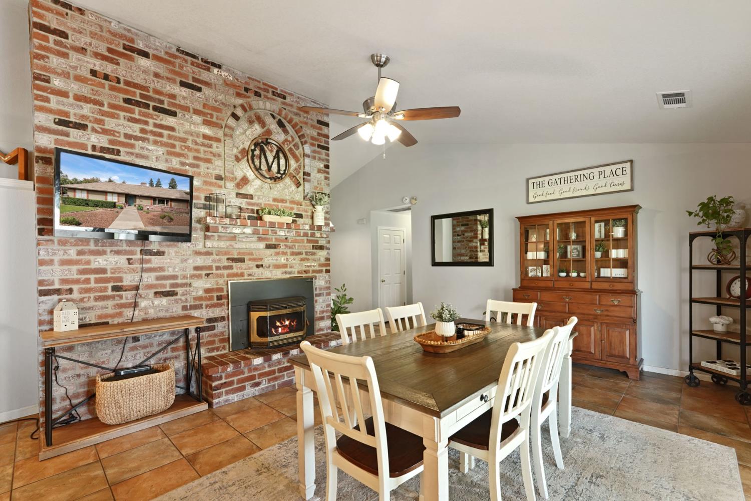 12963 Spring Time Lane Galt, CA 95632 - Photo 20 of 49 a view of a dining room with furniture and chandelier