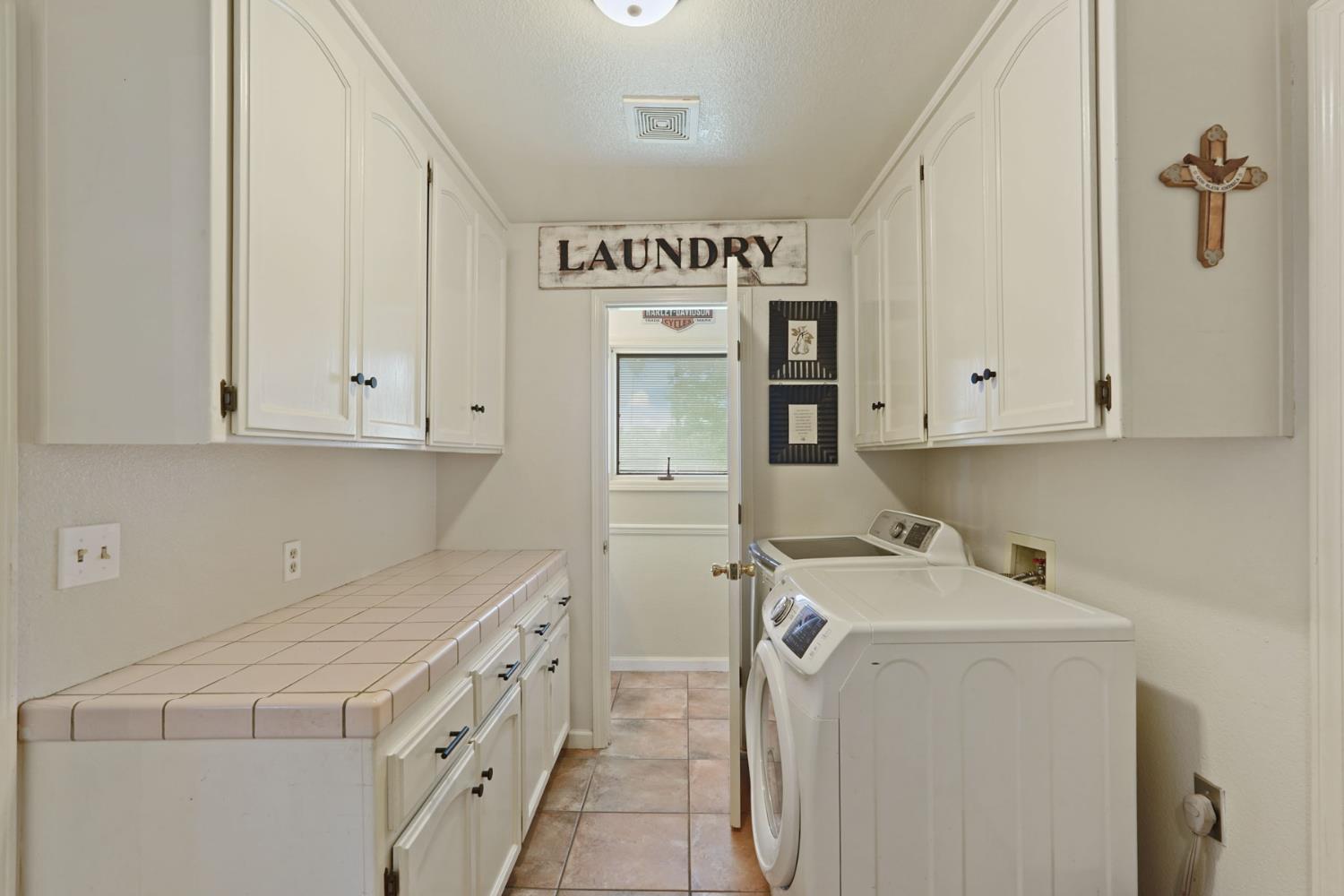 12963 Spring Time Lane Galt, CA 95632 - Photo 22 of 49 a utility room with faucet washer and dryer