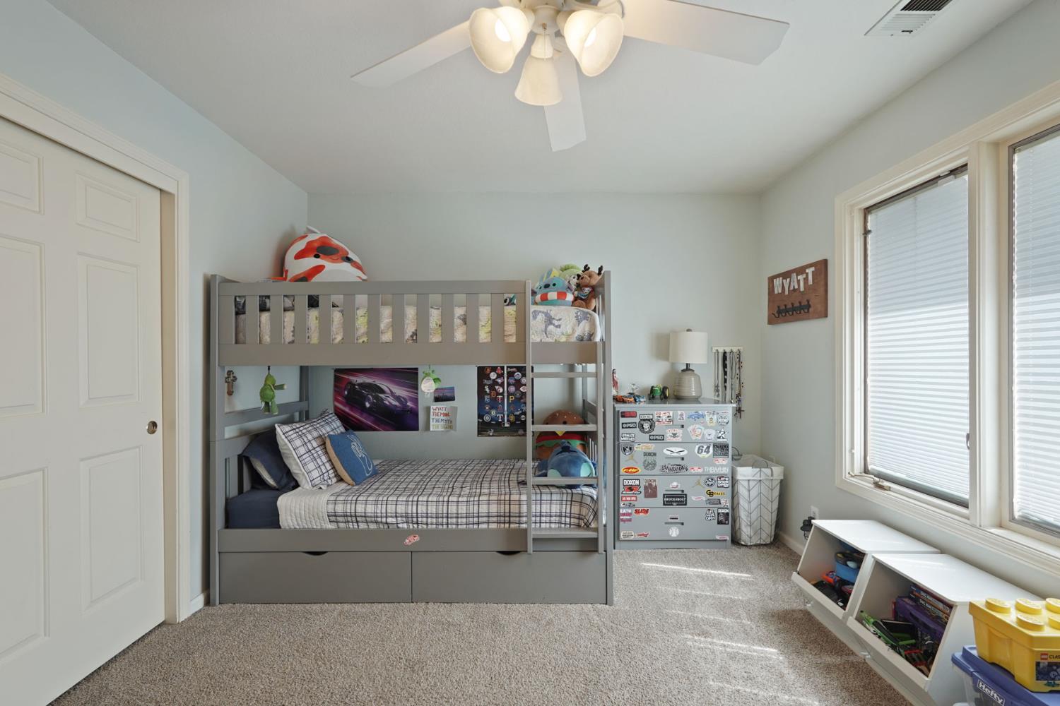 12963 Spring Time Lane Galt, CA 95632 - Photo 26 of 49 a bedroom with furniture and a wooden floor