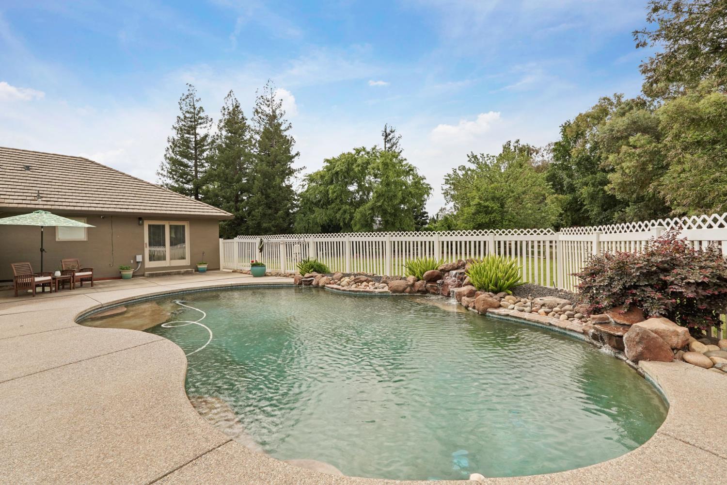 12963 Spring Time Lane Galt, CA 95632 - Photo 3 of 49 a view of a house with swimming pool