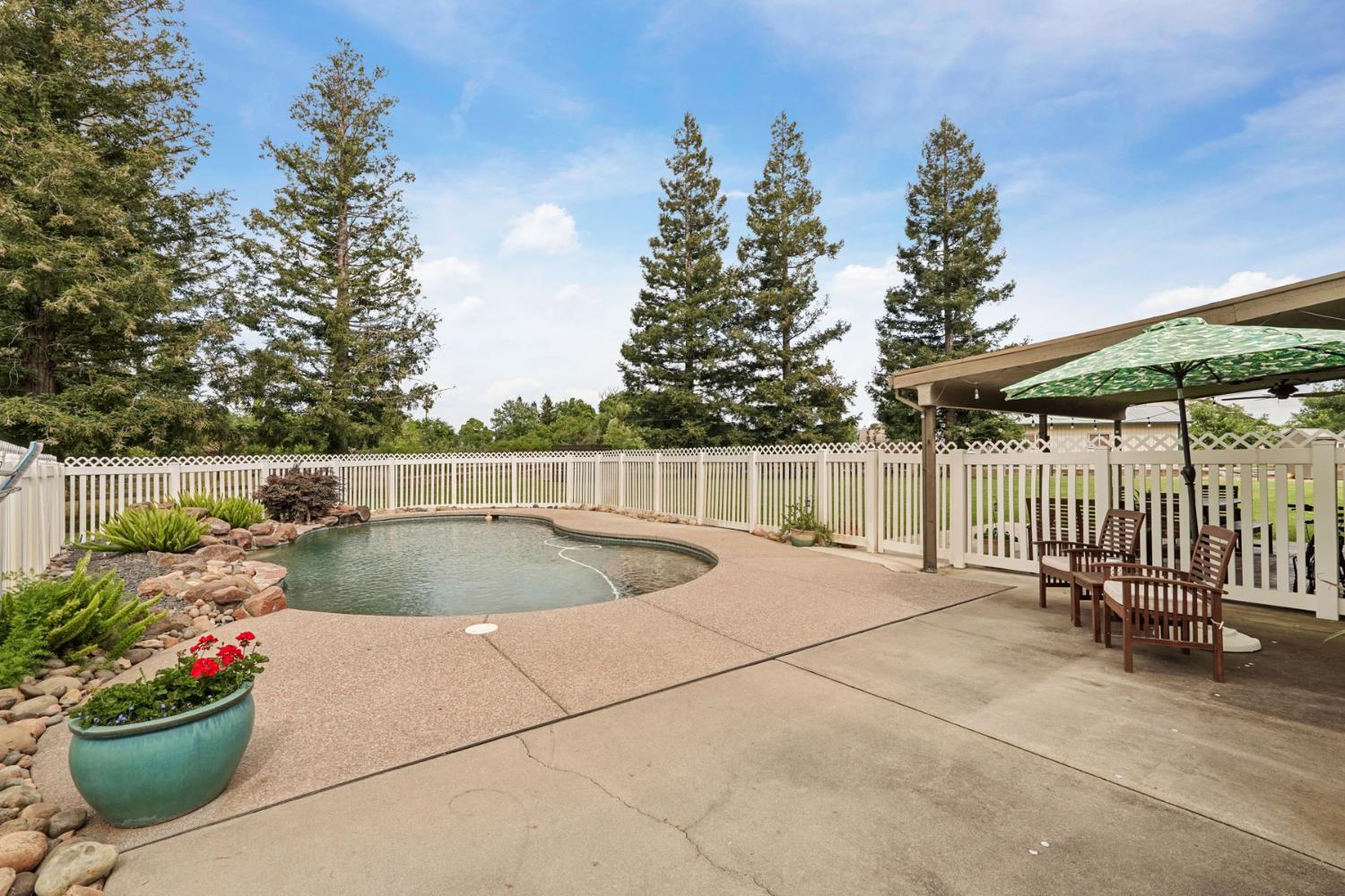 12963 Spring Time Lane Galt, CA 95632 - Photo 37 of 49 a view of a backyard