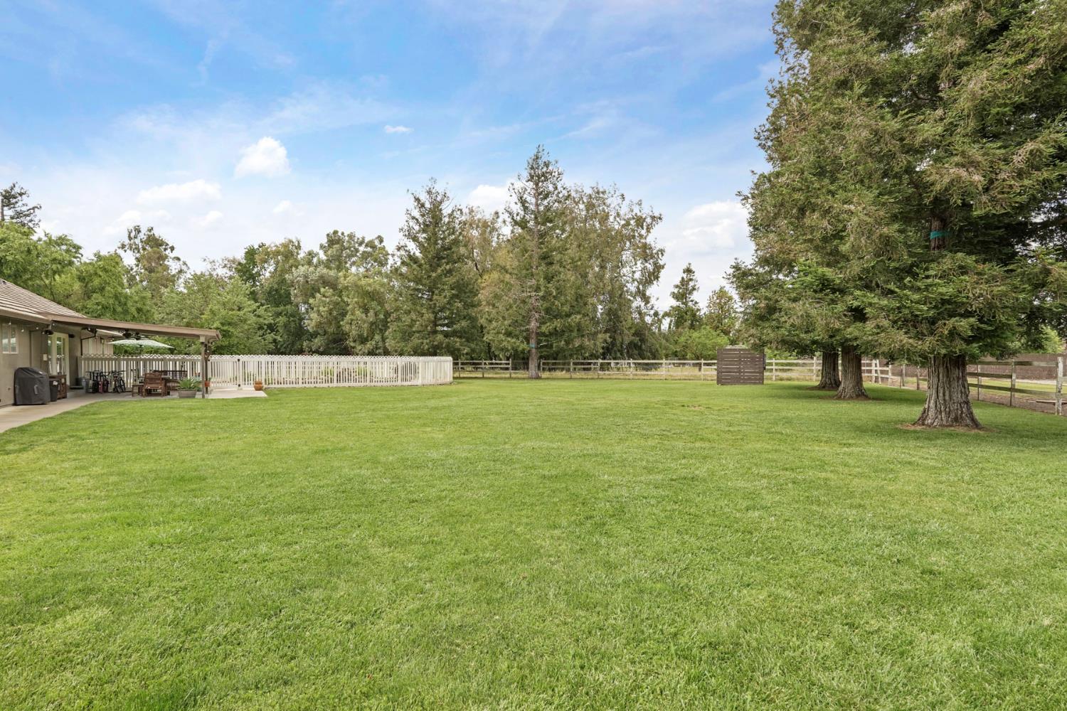 12963 Spring Time Lane Galt, CA 95632 - Photo 39 of 49 a view of a green field