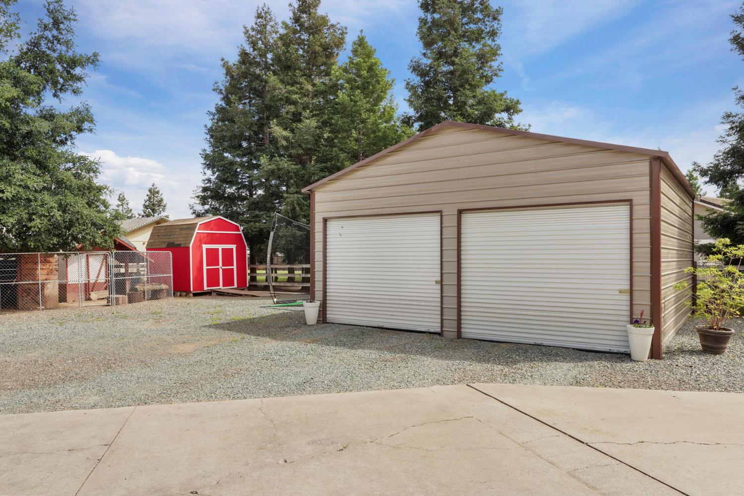 12963 Spring Time Lane Galt, CA 95632 - Photo 4 of 49 a front view of a house with a garage and garage