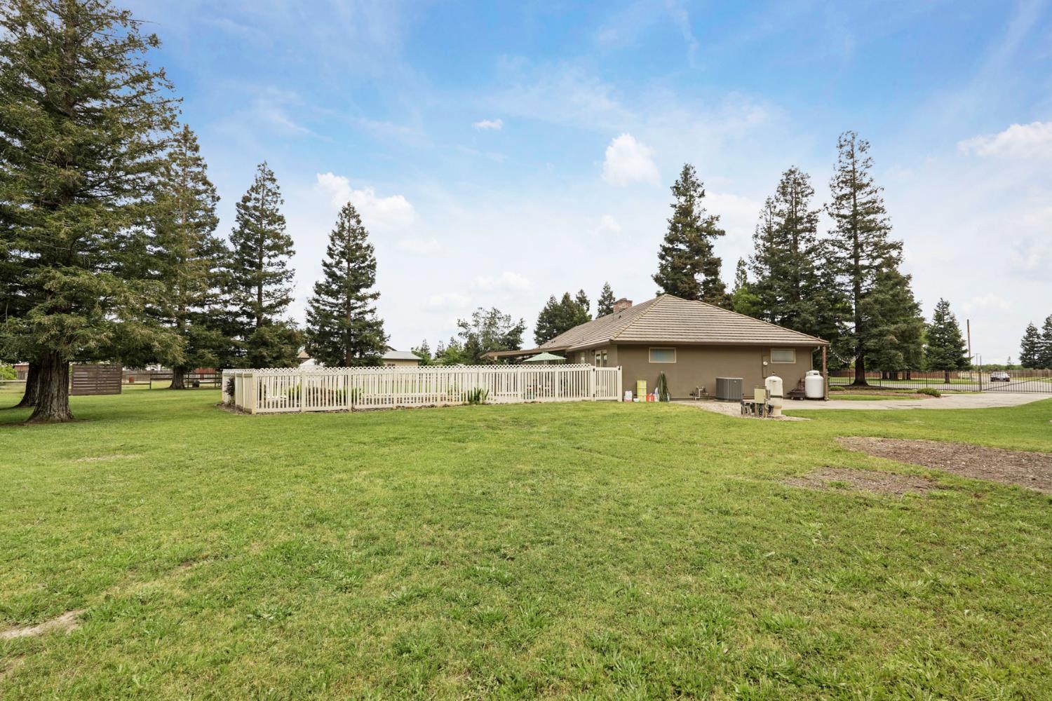 12963 Spring Time Lane Galt, CA 95632 - Photo 43 of 49 a view of a house with a yard