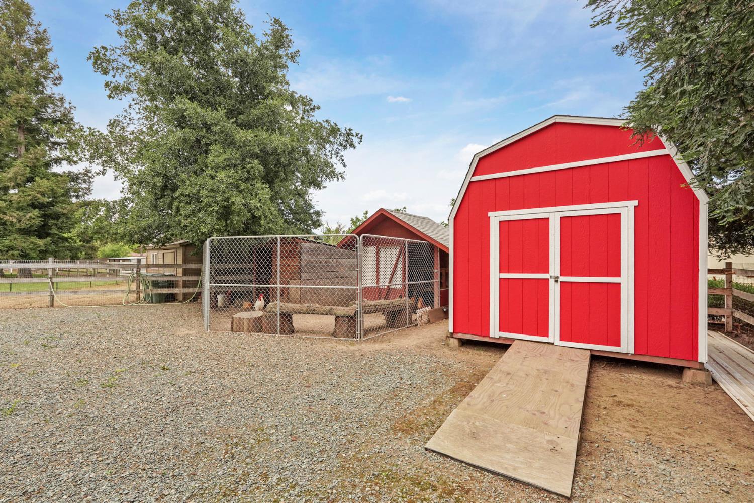 12963 Spring Time Lane Galt, CA 95632 - Photo 44 of 49 a front view of a house with garden
