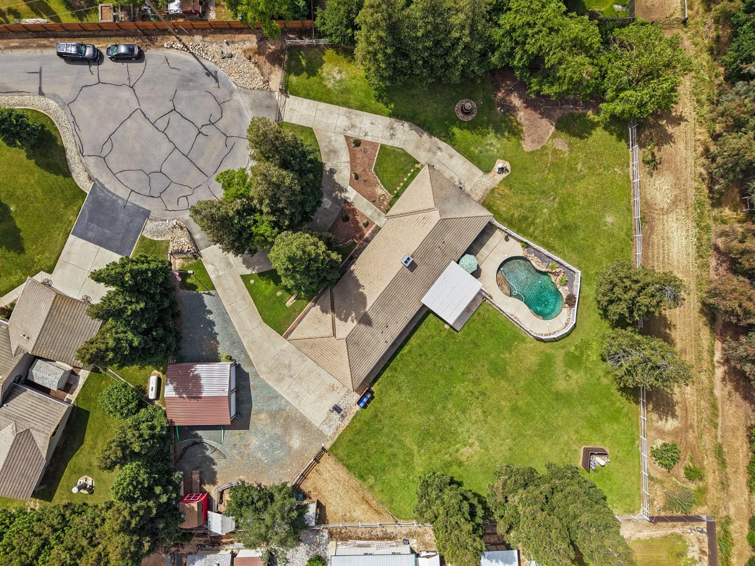 12963 Spring Time Lane Galt, CA 95632 - Photo 45 of 49 an aerial view of a house with swimming pool and garden