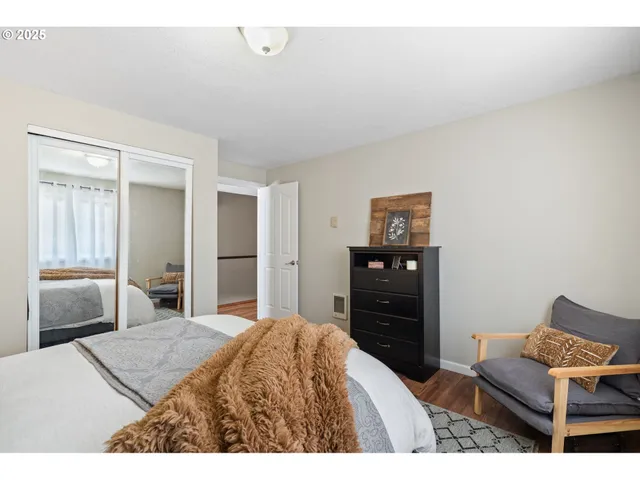 a bedroom with a bed and dresser