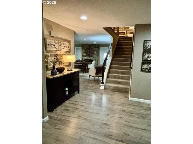 a view of a hallway with seating area