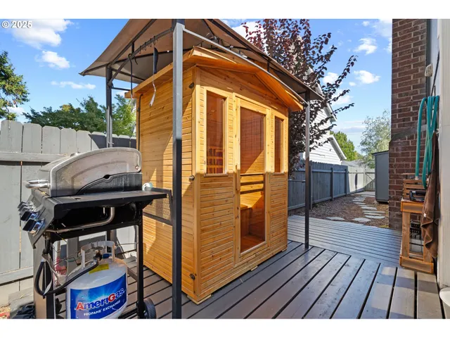a view of house with wooden floor and outdoor seating